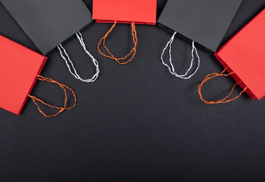 Red and black shopping bags arranged on a dark surface
